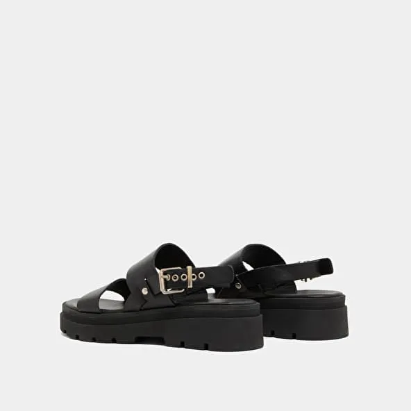 Sandals with thick straps and notched soles in black leather