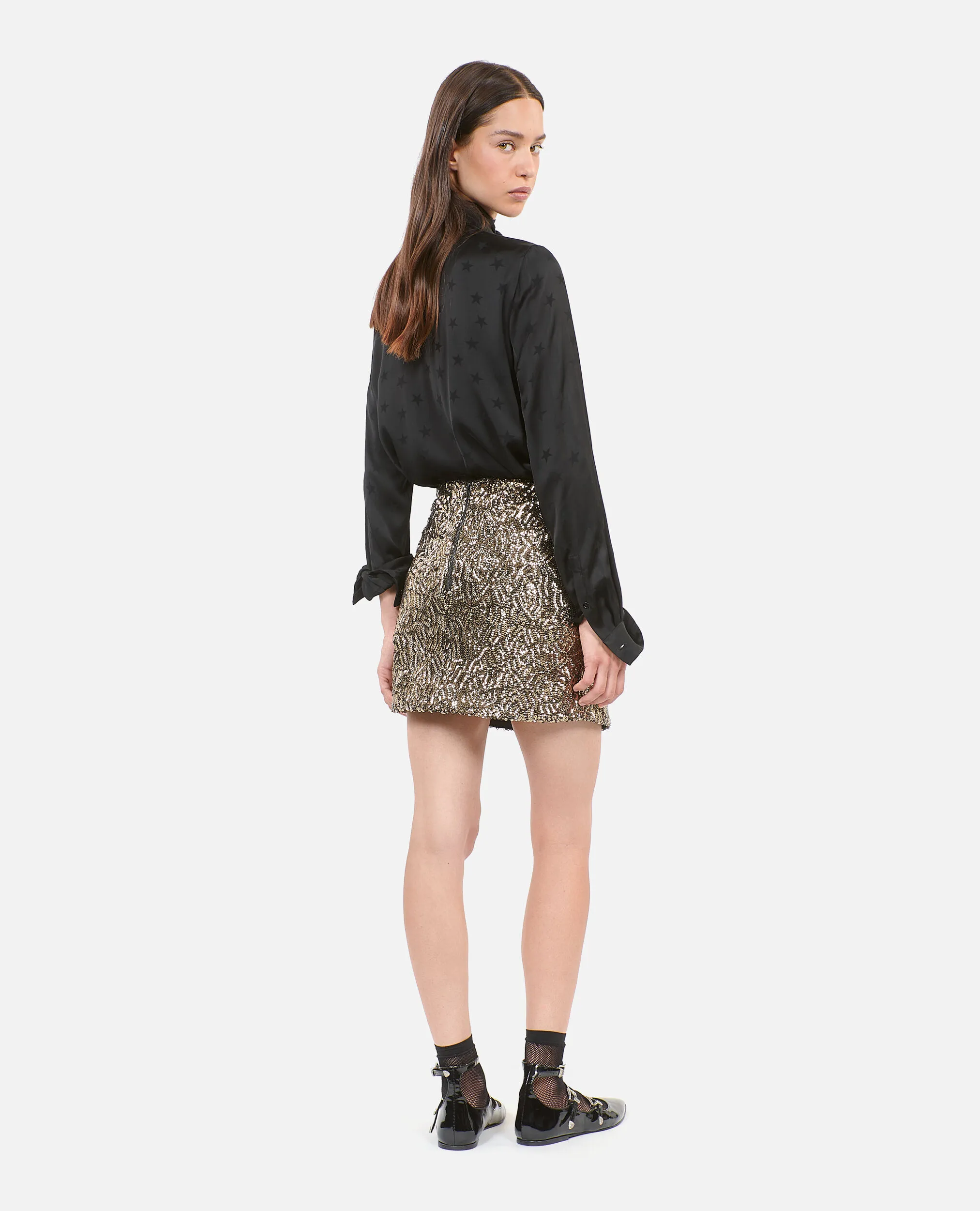 Short golden sequined skirt